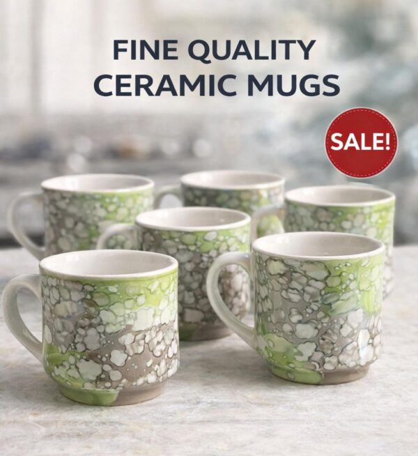 Long Description Refresh your drinkware collection with our Moss Green Marble Ceramic Mug Set. These mugs stand out with their distinctive "splatter" or "marble" glaze, creating a beautiful blend of earthy greens and neutral tones. Each piece is crafted to provide a premium feel, making every coffee break or tea session feel like a special occasion.  Key Features & Benefits: Unique Marbled Aesthetic: The organic, stone-like texture and vibrant green hues provide a refreshing and artistic look that complements any kitchen or office decor.  Premium Ceramic Build: High-fired ceramic ensures long-lasting durability, chip resistance, and excellent heat retention for your drinks.  Ergonomic Comfort Handle: Features a spacious, smooth-finish handle designed for a secure and comfortable grip, even when the mug is full.  Smooth High-Gloss Finish: The high-quality glaze not only looks beautiful but also makes the surface non-stick and easy to clean.  Versatile Utility: Perfect for a wide variety of drinks, including masala chai, freshly brewed coffee, hot milk, or herbal teas.  Daily Convenience: Fully safe for use in the microwave for quick reheating and dishwasher safe for effortless cleanup.